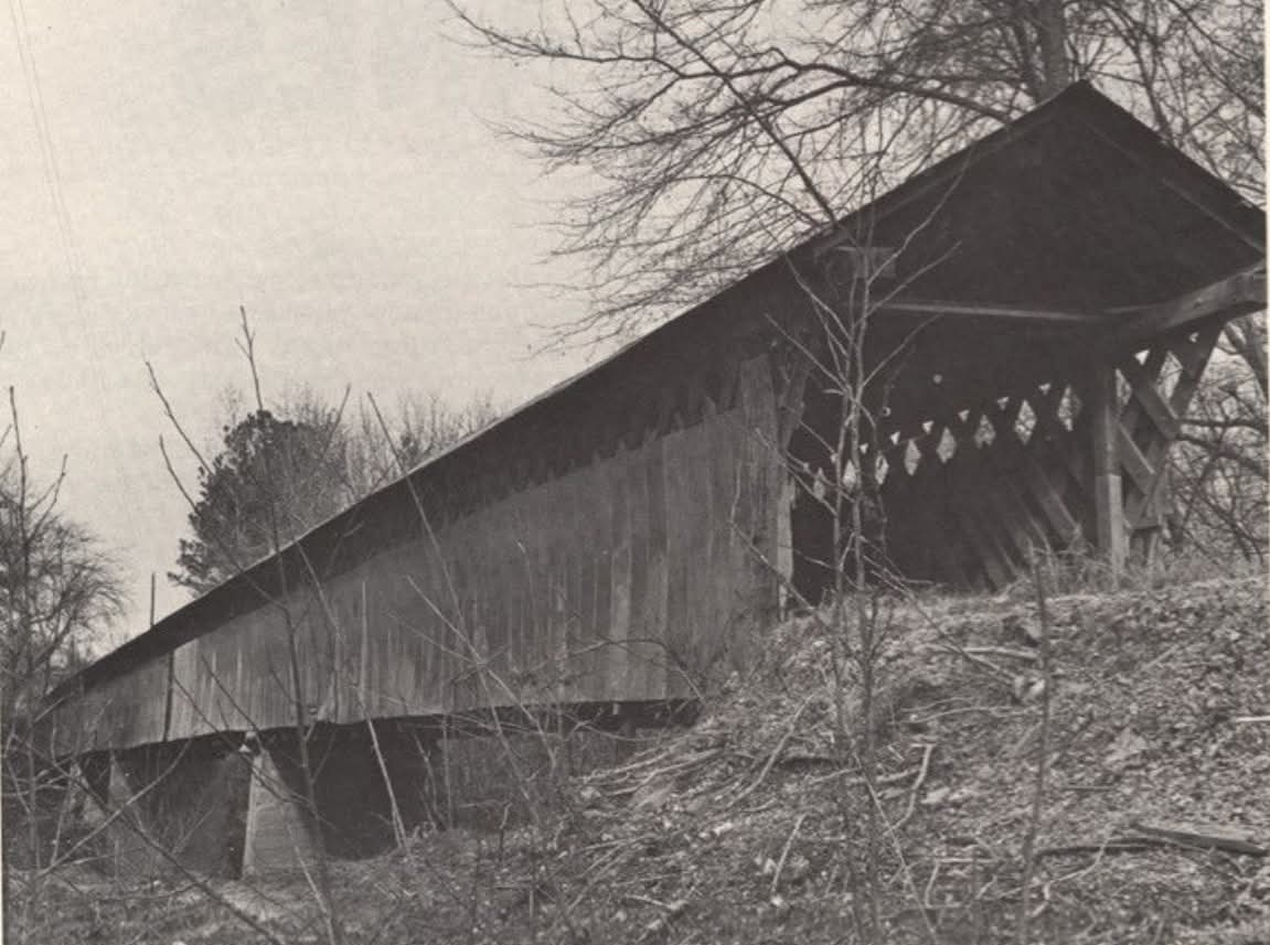 Black and white 1970s photograph of the Swann covered bridge showing the Town lattice truss detail